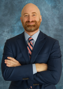 Headshot Chris Gloede Vertical Blue Headshot Chris Gloede Vertical Blue